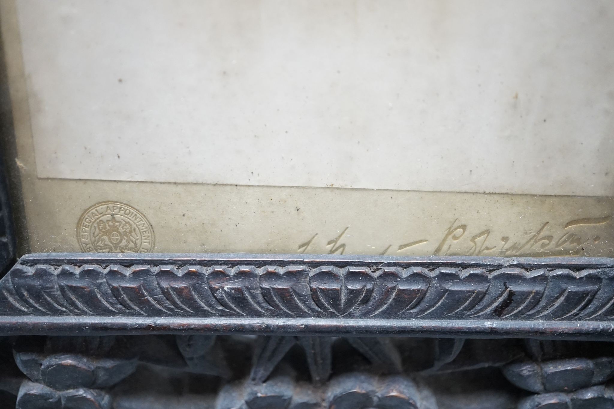 A Chinese carved hongmu ‘dragon’ photo easel frame and a similar ’prunus’ frame, c.1900 (2), Dragon frame 27 cms high x 22cms wide.
